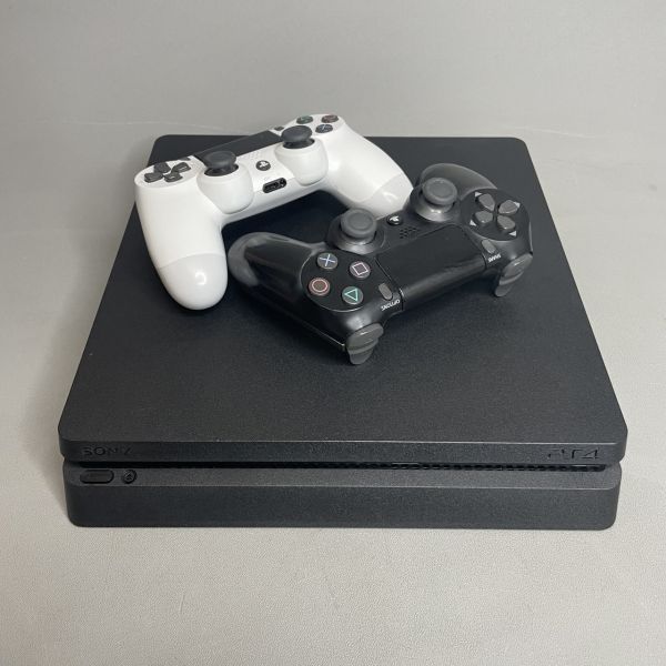 Игровая приставка Sony PlayStation 4 Slim 1000 ГБ HDD, без игр, черный + 2 геймпада